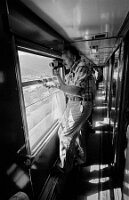 Américain à la Fenetre du Wagon